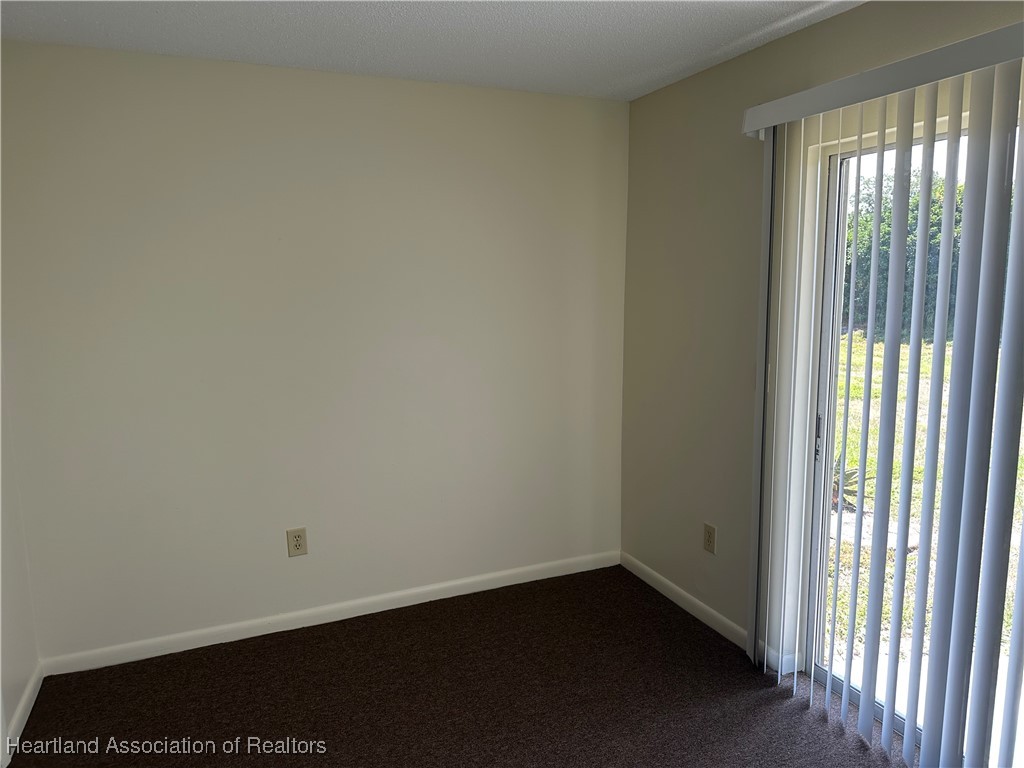 7422 Valencia Road Sebring, FL 33876 - Photo 7 of 15 a view of an empty room and window