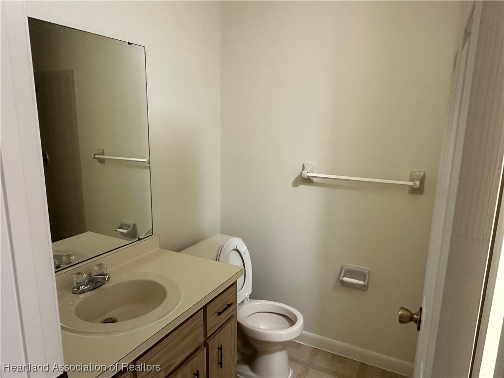 7422 Valencia Road Sebring, FL 33876 - Photo 10 of 15 a bathroom with a sink and toilet