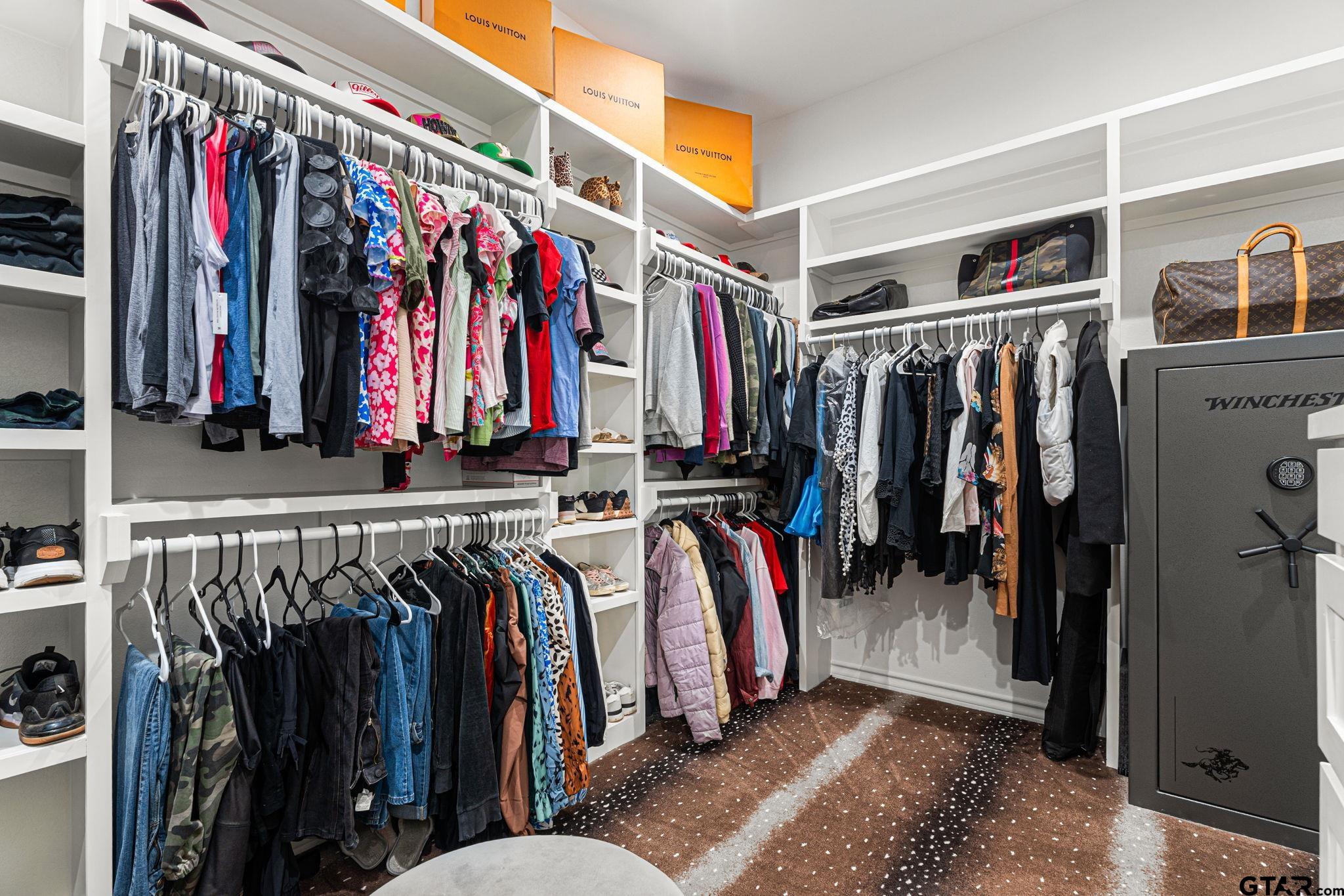 12293 Harlon Street Flint, TX 75762 - Photo 17 of 33 a view of walk in closet with clothes