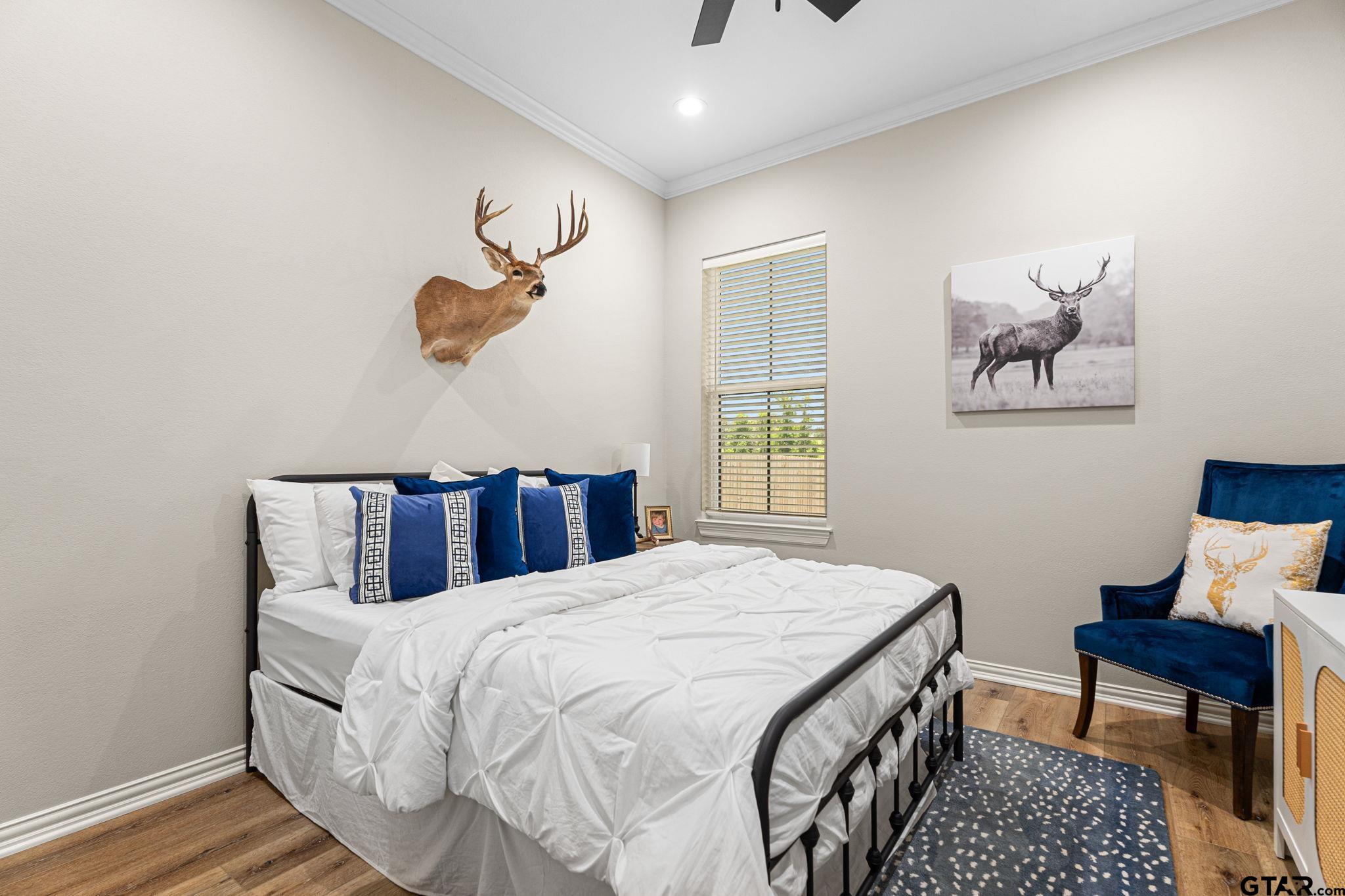 12293 Harlon Street Flint, TX 75762 - Photo 25 of 33 a bed room with a bed and a chair