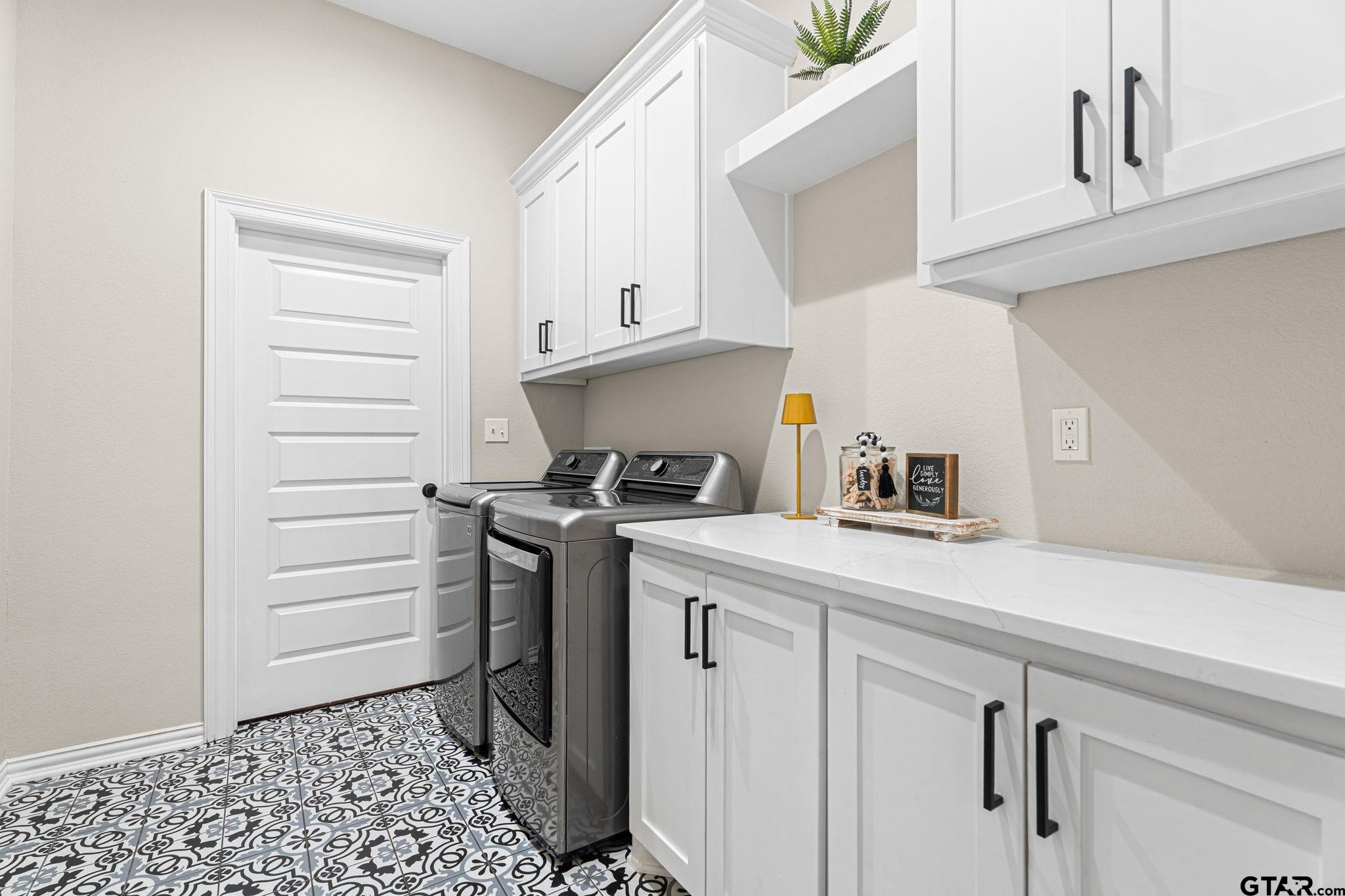 12293 Harlon Street Flint, TX 75762 - Photo 27 of 33 a kitchen with a sink a stove and cabinets