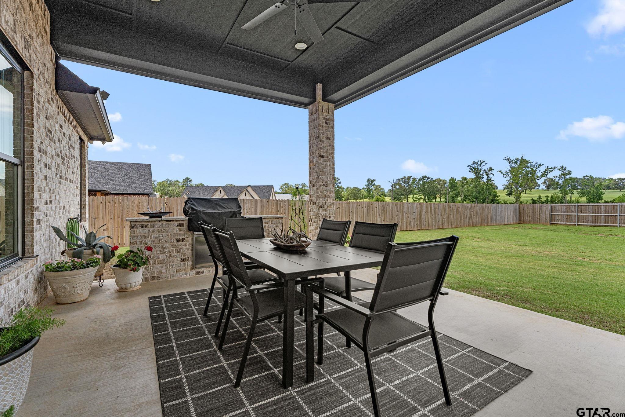 12293 Harlon Street Flint, TX 75762 - Photo 28 of 33 a view of a patio with a table chairs and a table
