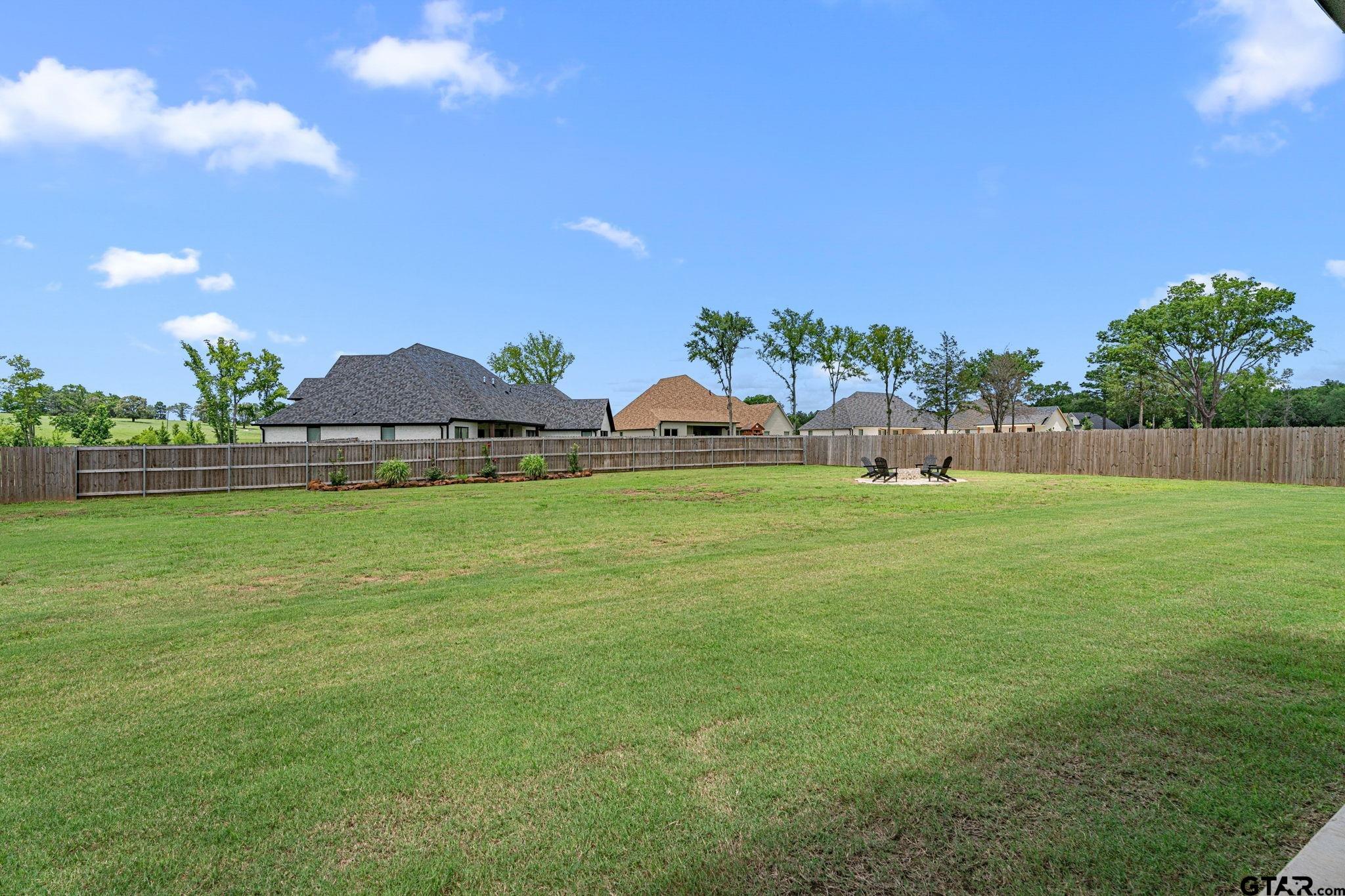 12293 Harlon Street Flint, TX 75762 - Photo 30 of 33 a view of outdoor space with deck and yard