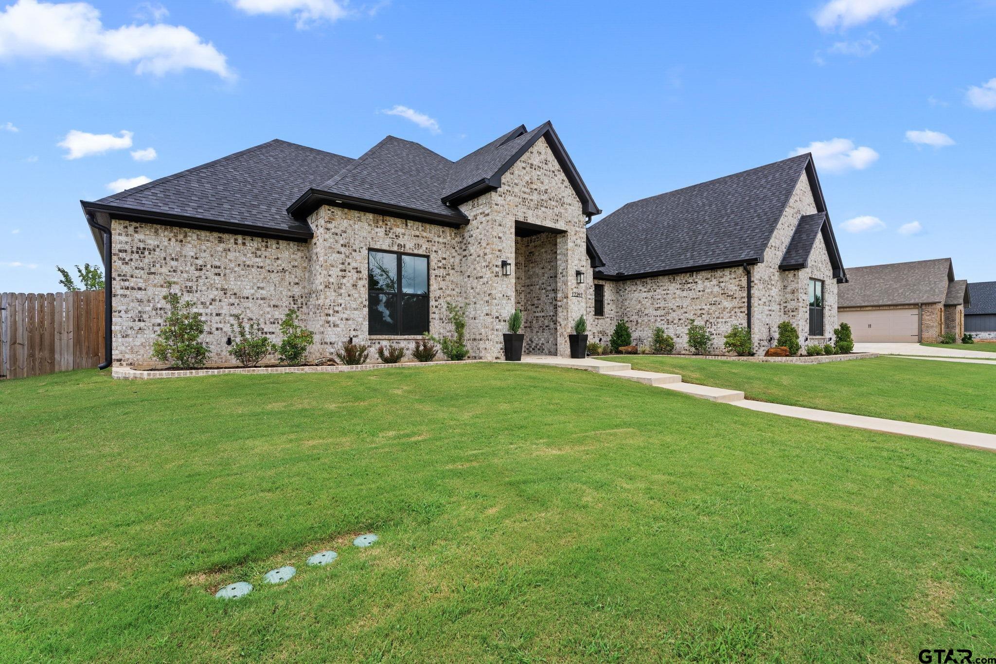 12293 Harlon Street Flint, TX 75762 - Photo 3 of 33 a front view of a house with a yard