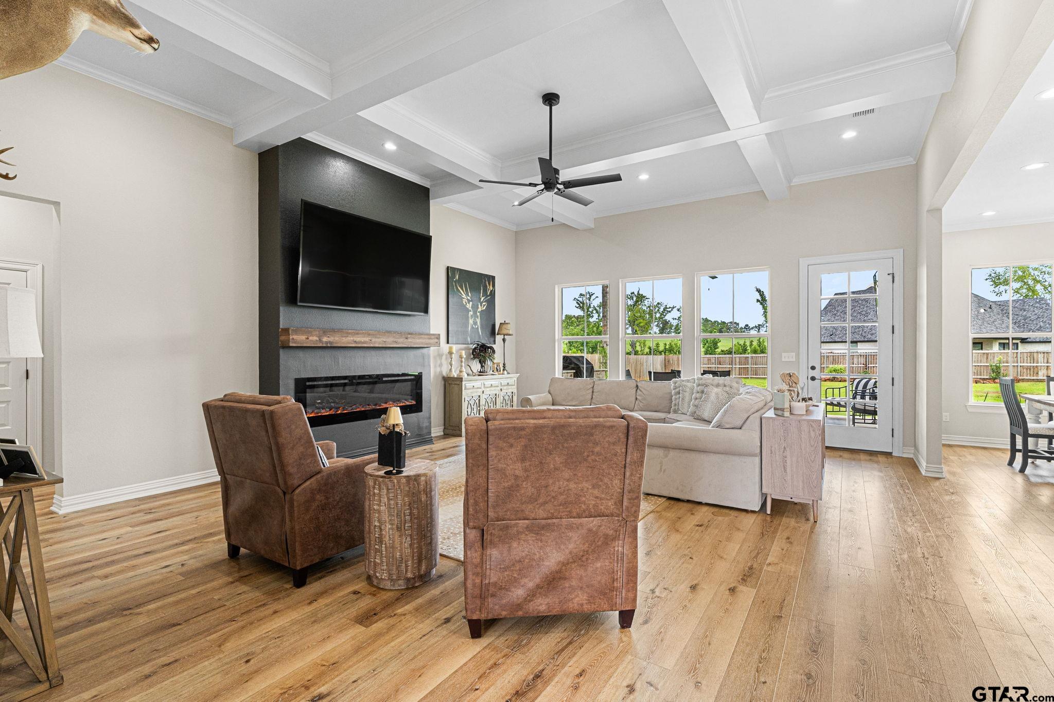 12293 Harlon Street Flint, TX 75762 - Photo 4 of 33 a living room with fireplace furniture and a flat screen tv