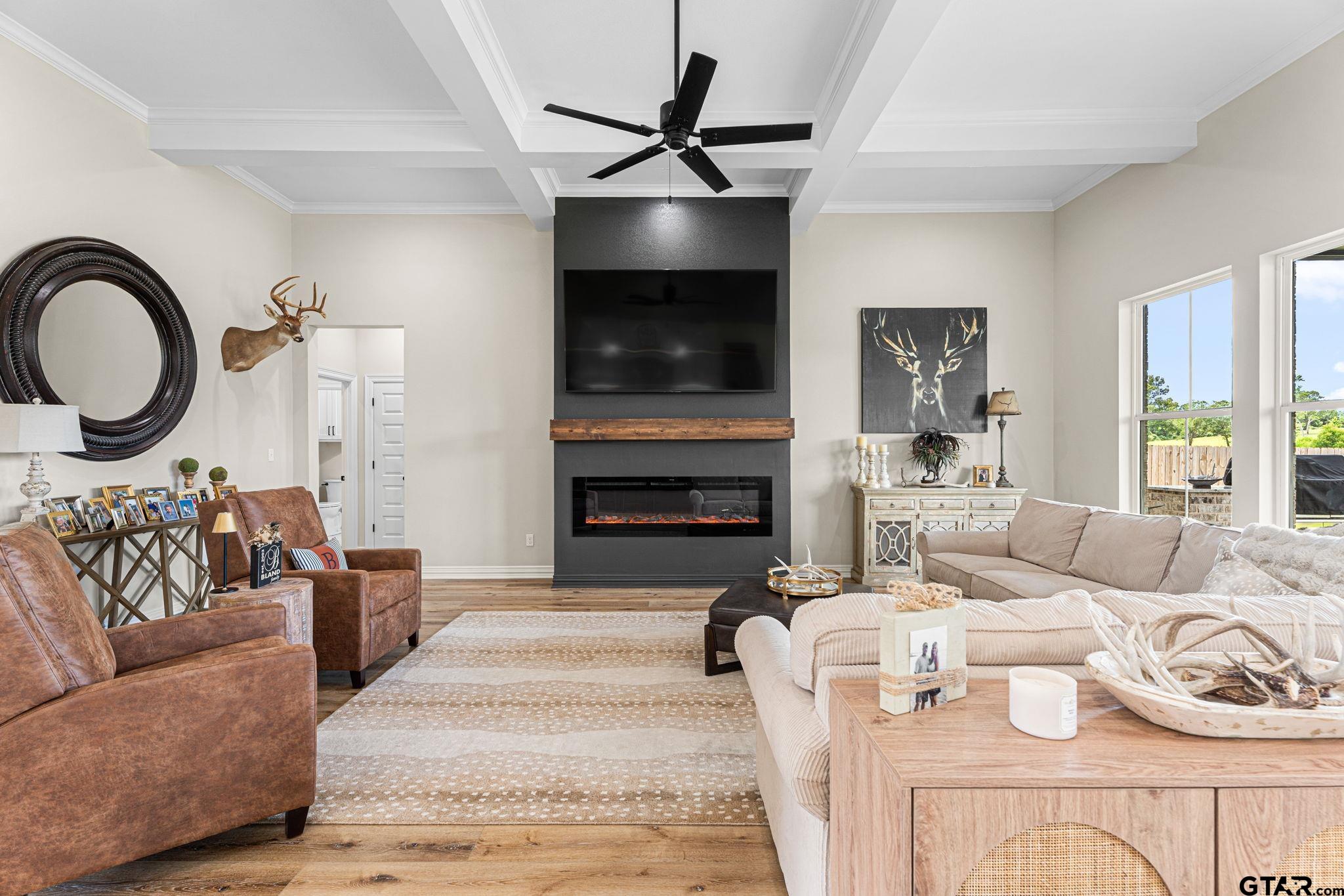 12293 Harlon Street Flint, TX 75762 - Photo 5 of 33 a living room with furniture a flat screen tv and a fireplace