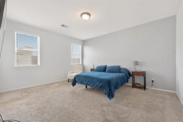 a living room with a bed furniture and a window
