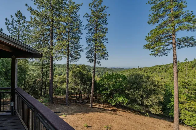 a view of a table and chairs in the patio