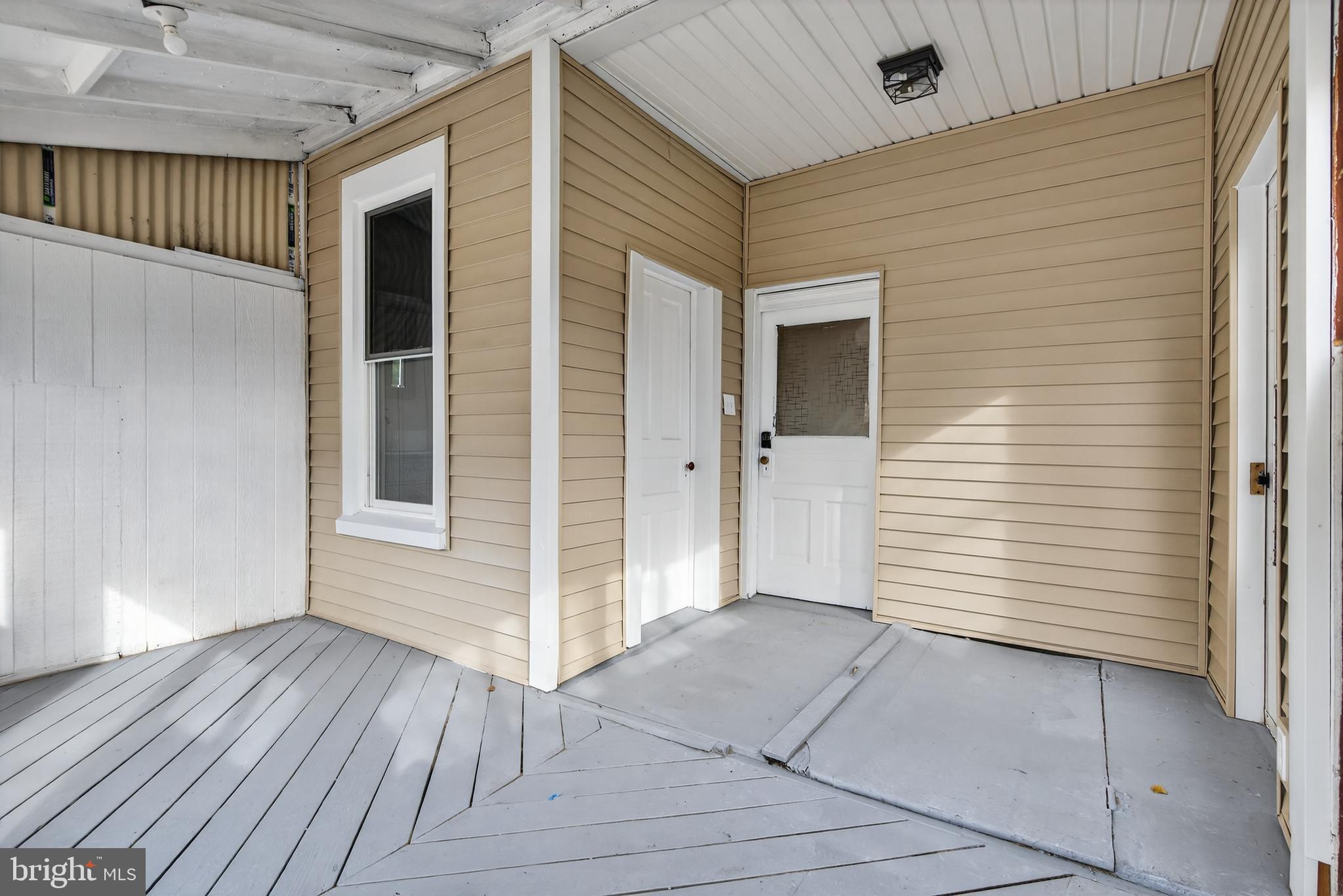 202 South Main Street Red Lion, PA 17356 - Photo 15 of 39 an empty room with wooden floor and windows