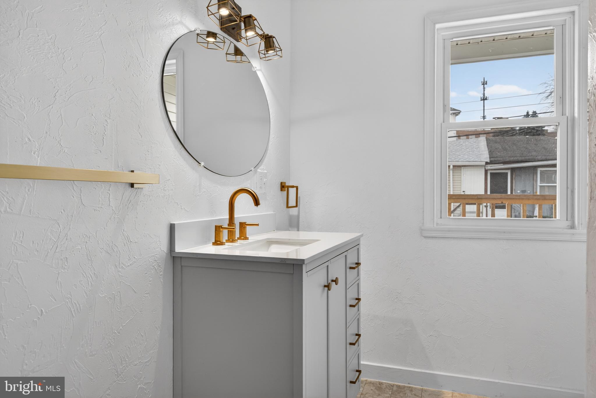 202 South Main Street Red Lion, PA 17356 - Photo 27 of 39 a bathroom with a sink and a mirror