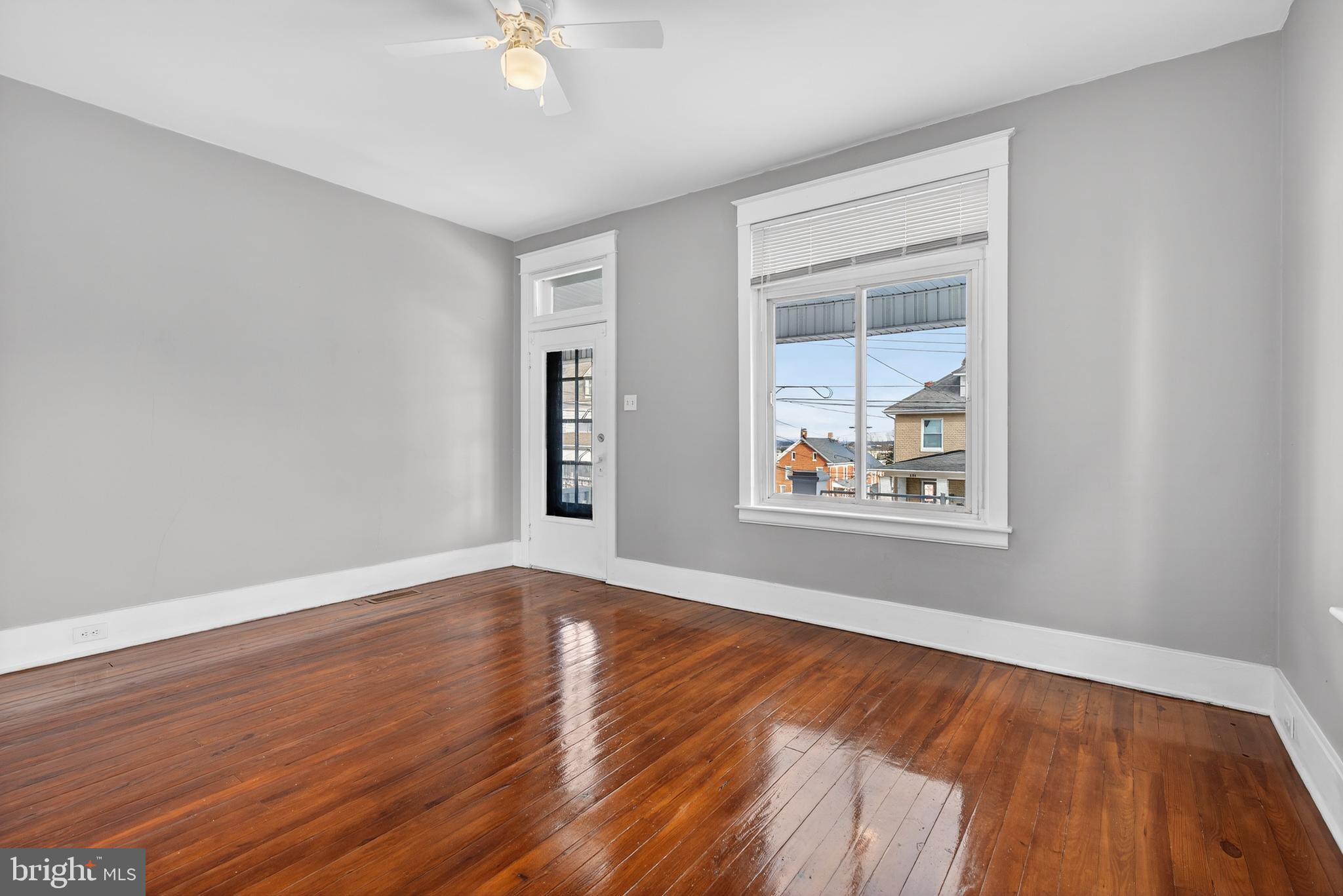 202 South Main Street Red Lion, PA 17356 - Photo 6 of 39 a view of an empty room with wooden floor and a window