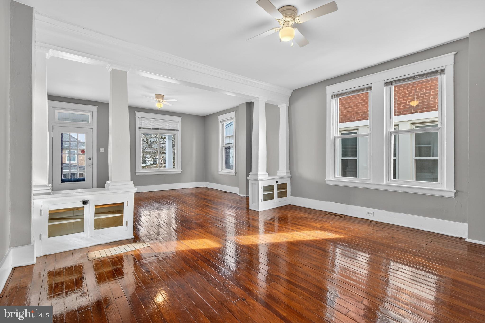 202 South Main Street Red Lion, PA 17356 - Photo 8 of 39 a view of an empty room with wooden floor and a window