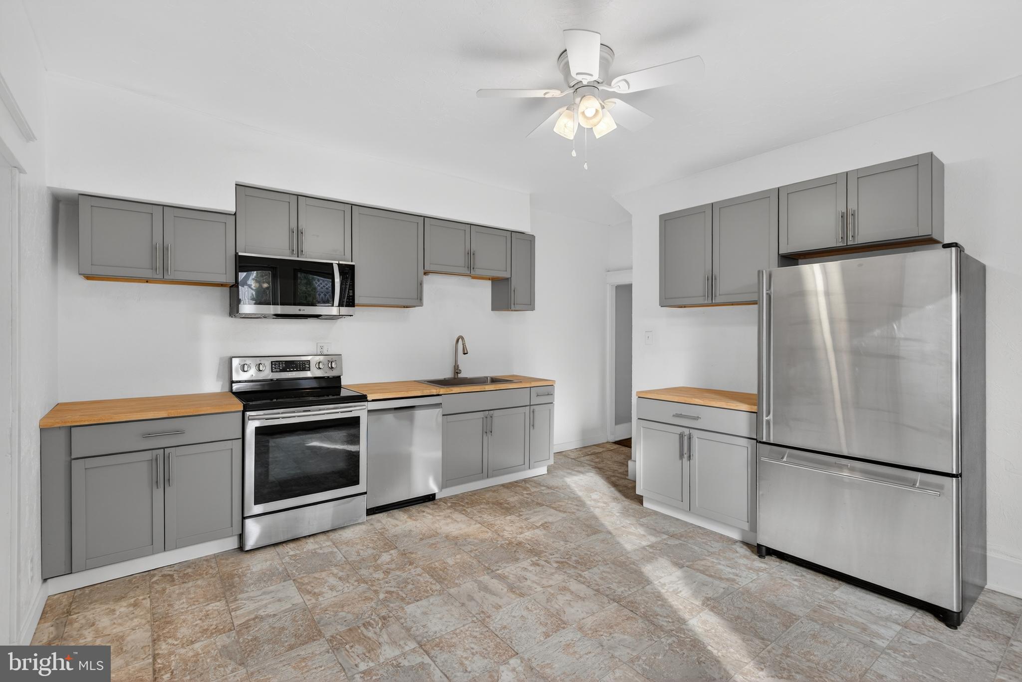 202 South Main Street Red Lion, PA 17356 - Photo 10 of 39 a kitchen with stainless steel appliances a refrigerator stove and microwave