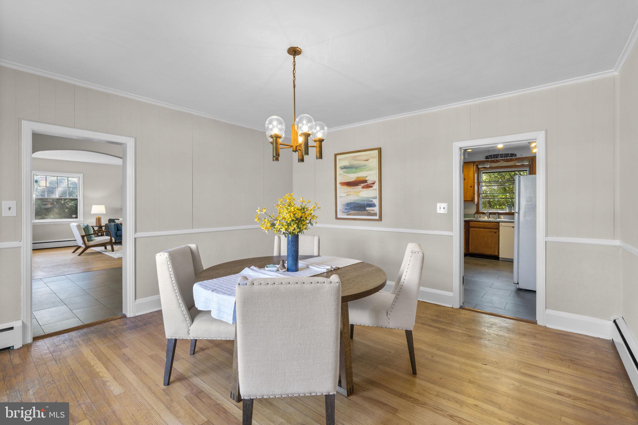 211 West Maple Road Linthicum Heights, MD 21090 - Photo 9 of 44 Dining room with chair rail and crown molding