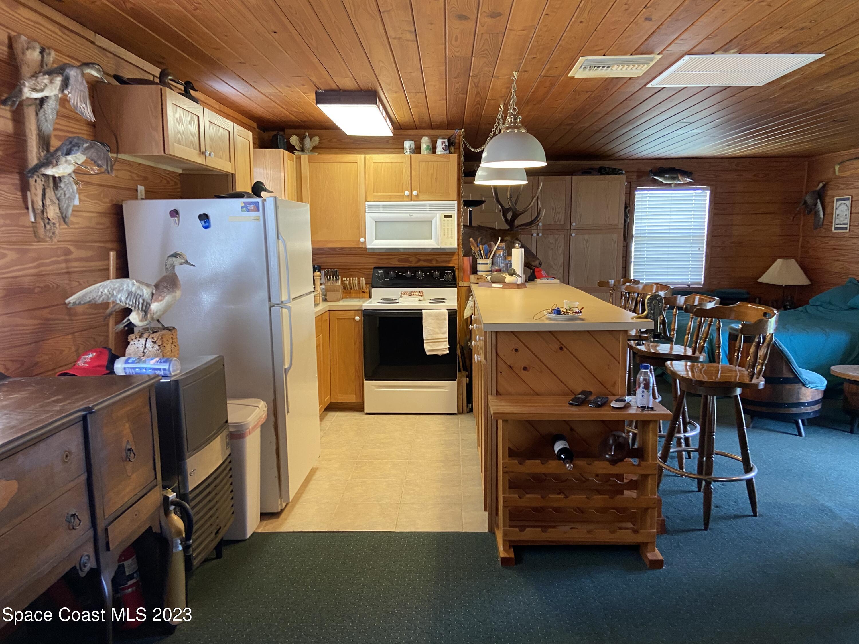 5757 Lake Poinsett Road Cocoa, FL 32926 - Photo 13 of 43 a utility room with dryer and washer