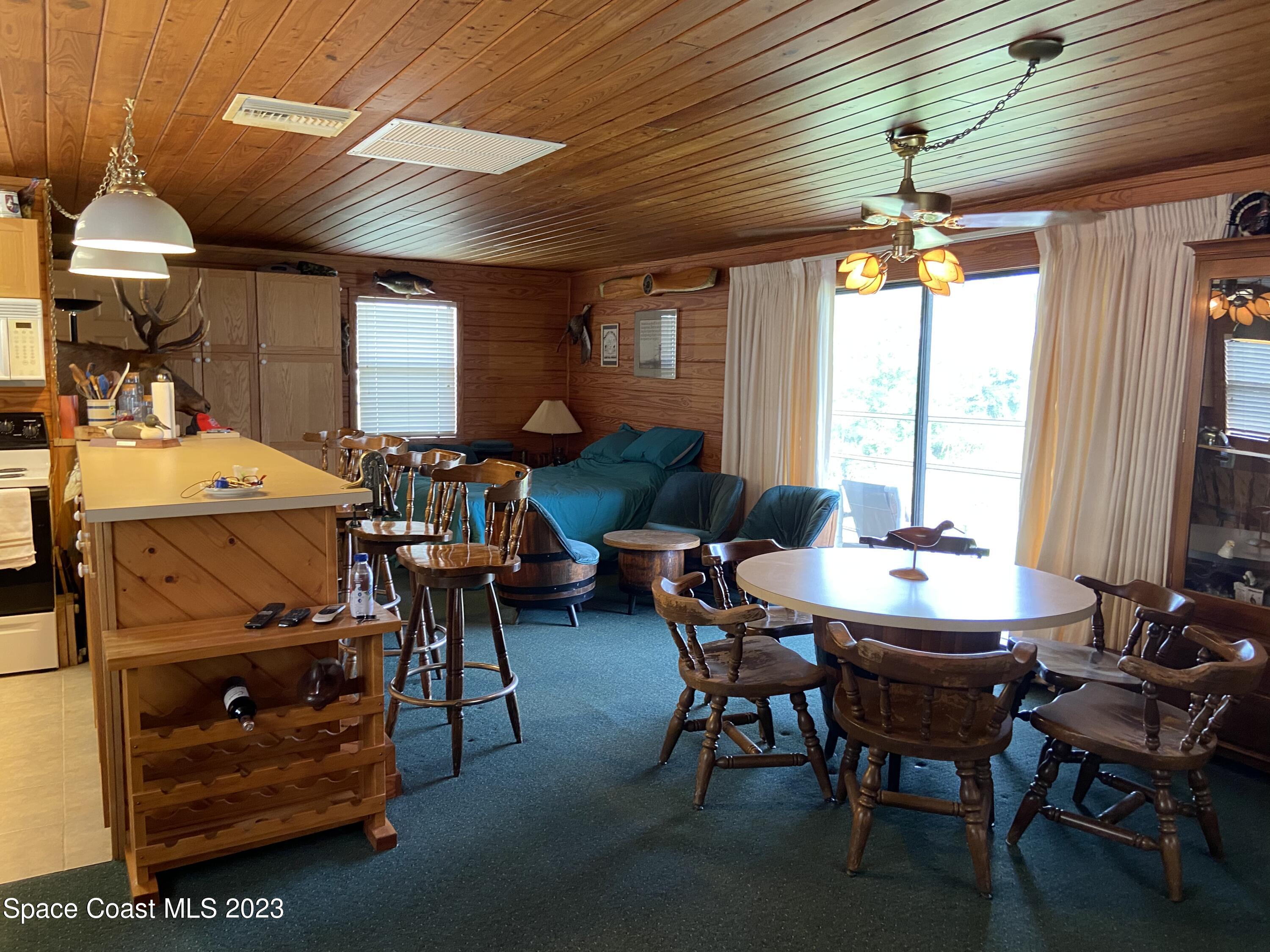 5757 Lake Poinsett Road Cocoa, FL 32926 - Photo 15 of 43 a dining room with furniture and window