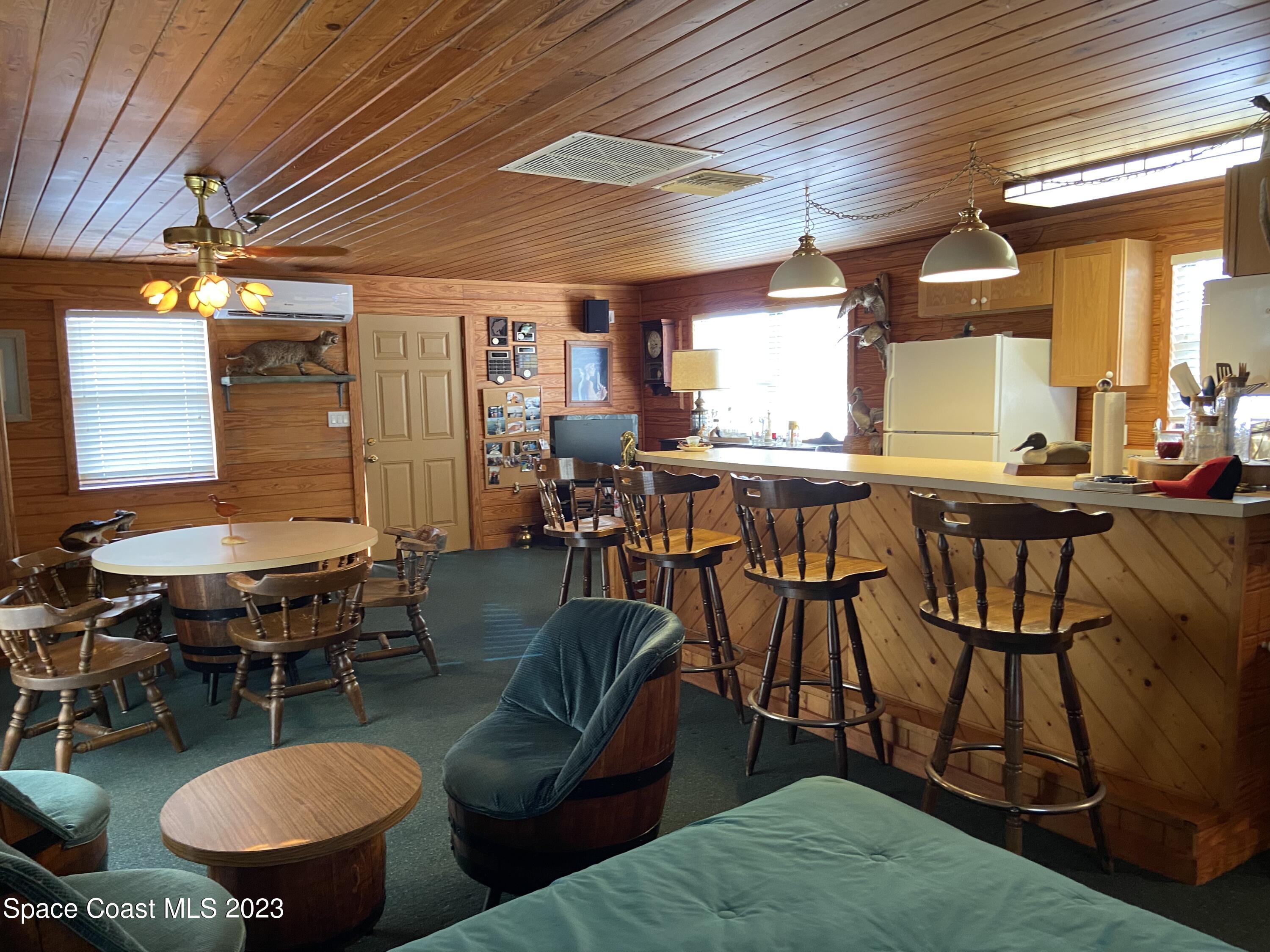 5757 Lake Poinsett Road Cocoa, FL 32926 - Photo 20 of 43 a living room with lots of furniture and a table