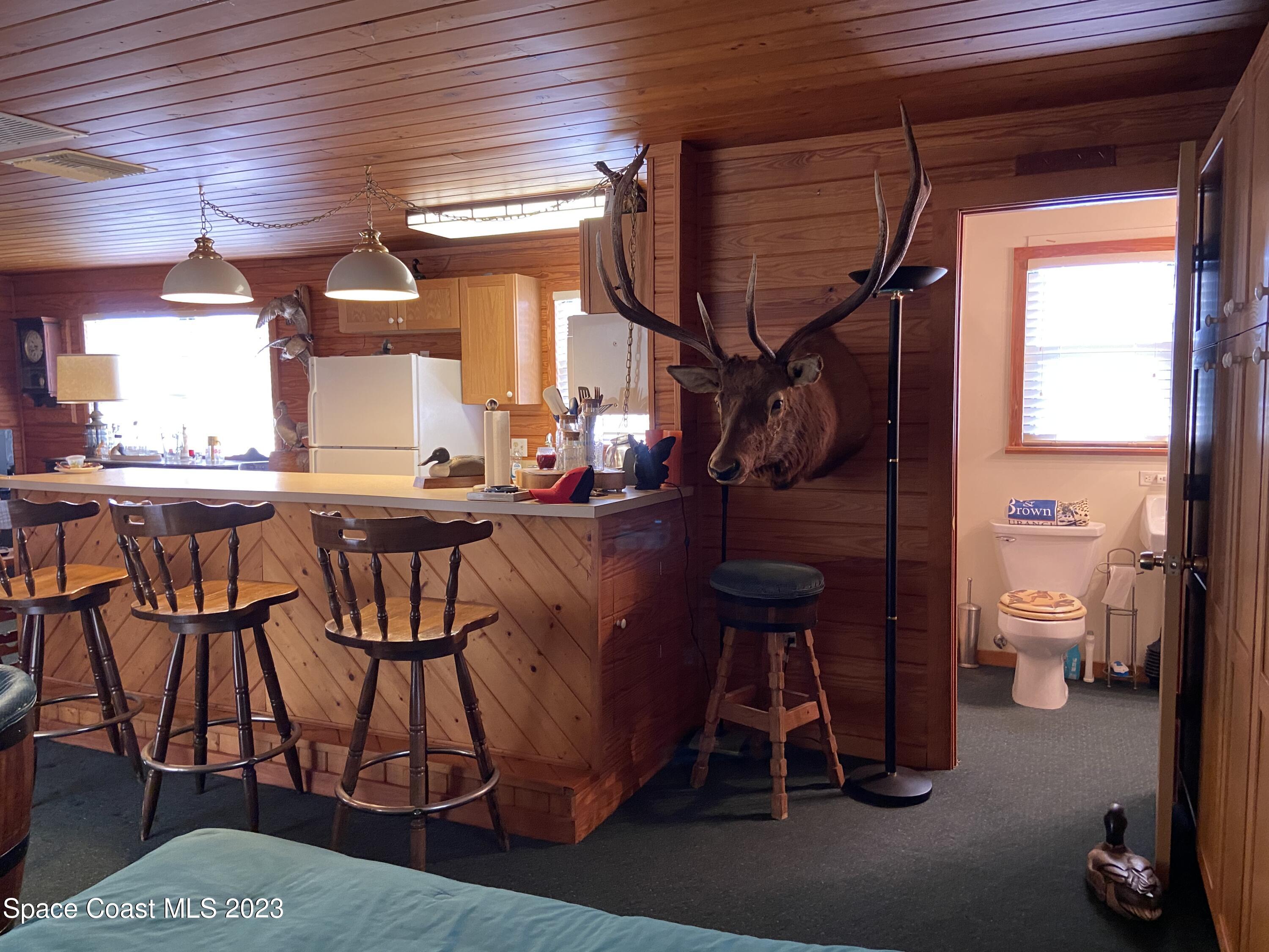 5757 Lake Poinsett Road Cocoa, FL 32926 - Photo 26 of 43 a dining room with furniture and a window