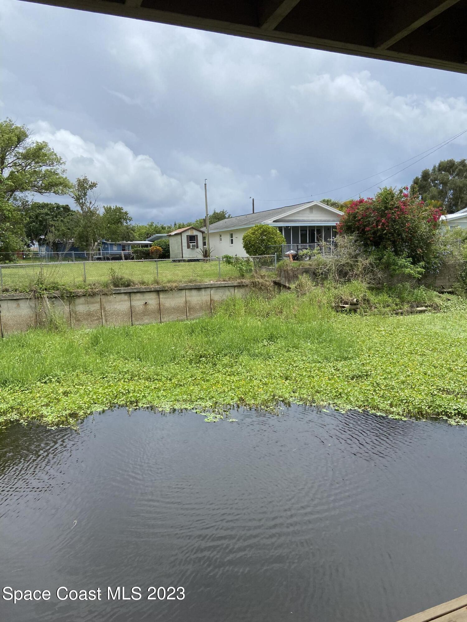 5757 Lake Poinsett Road Cocoa, FL 32926 - Photo 29 of 43 a front view of a house with a yard