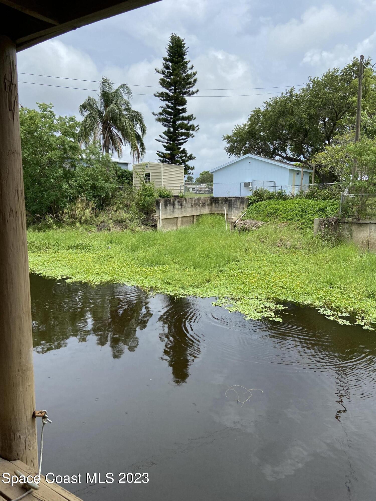 5757 Lake Poinsett Road Cocoa, FL 32926 - Photo 31 of 43 a view of a lake view with a big yard