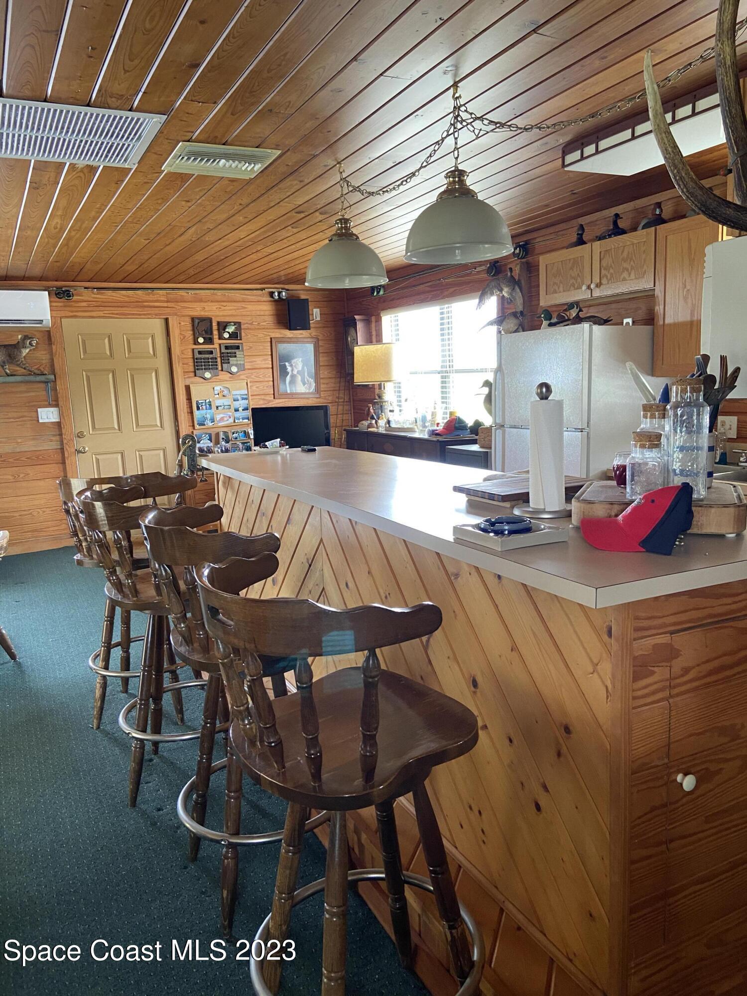 5757 Lake Poinsett Road Cocoa, FL 32926 - Photo 35 of 43 a dinning table and chairs in a room