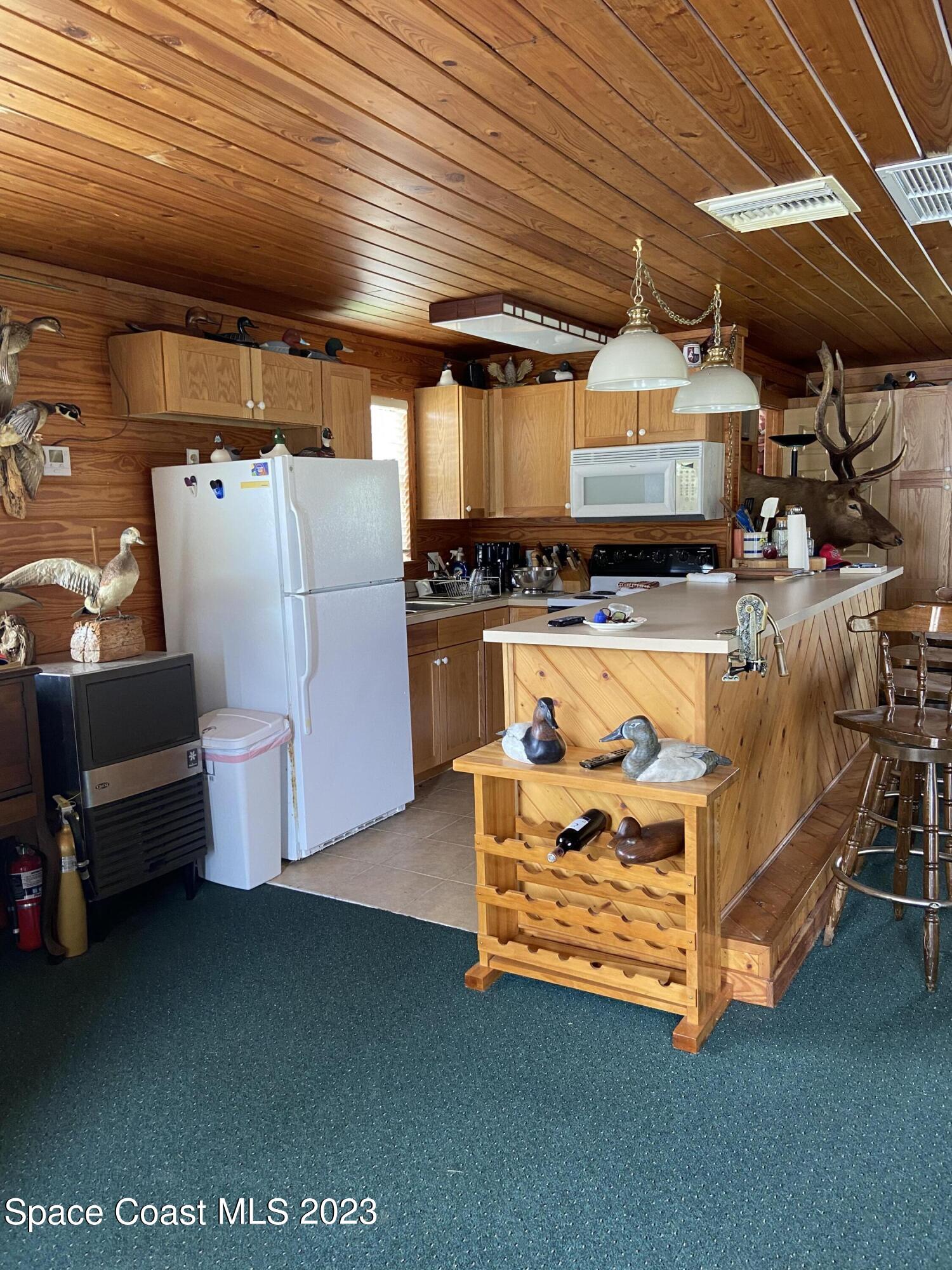 5757 Lake Poinsett Road Cocoa, FL 32926 - Photo 36 of 43 a utility room with dryer and washer