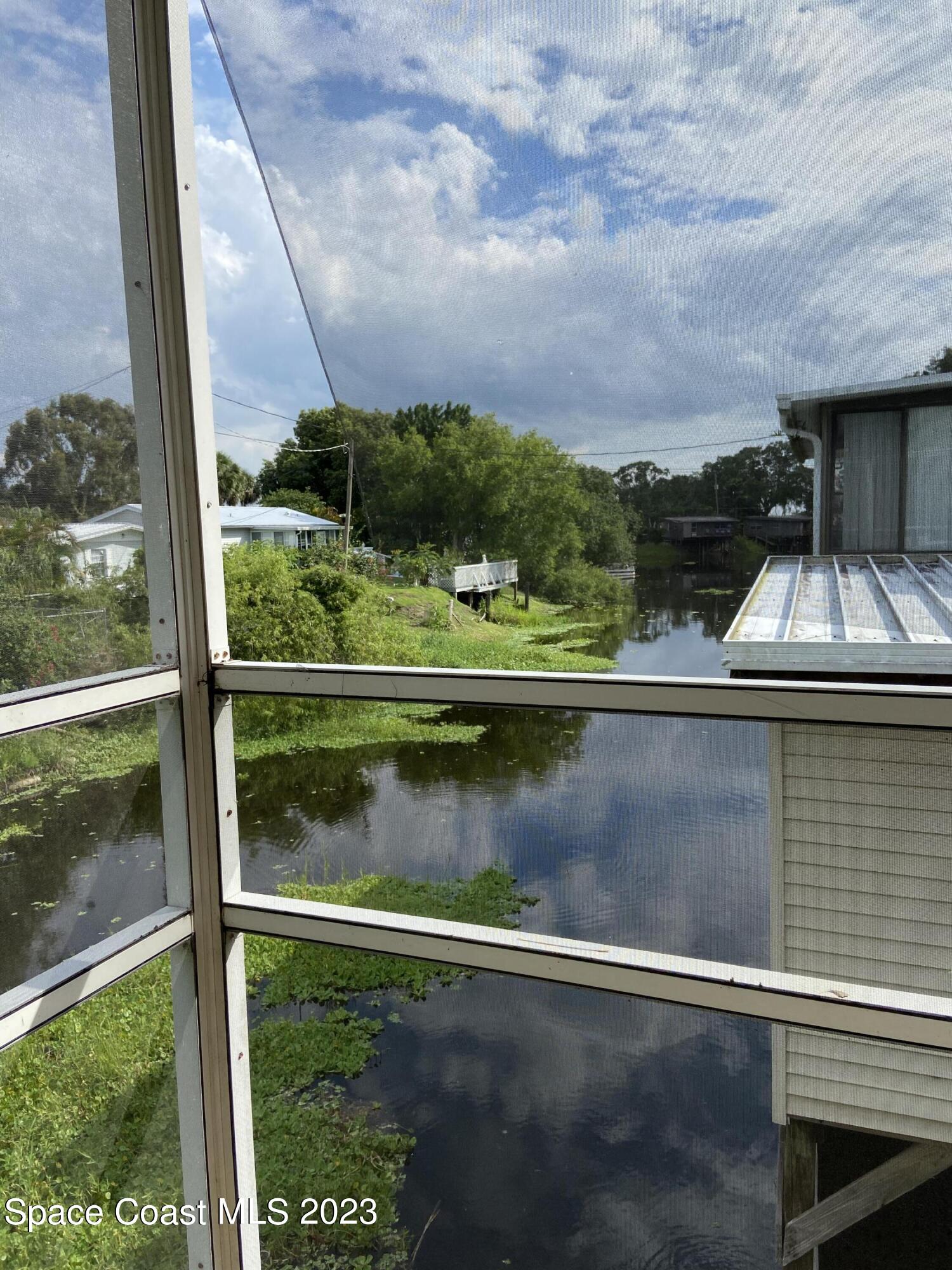 5757 Lake Poinsett Road Cocoa, FL 32926 - Photo 6 of 43 a view of swimming pool from a lake