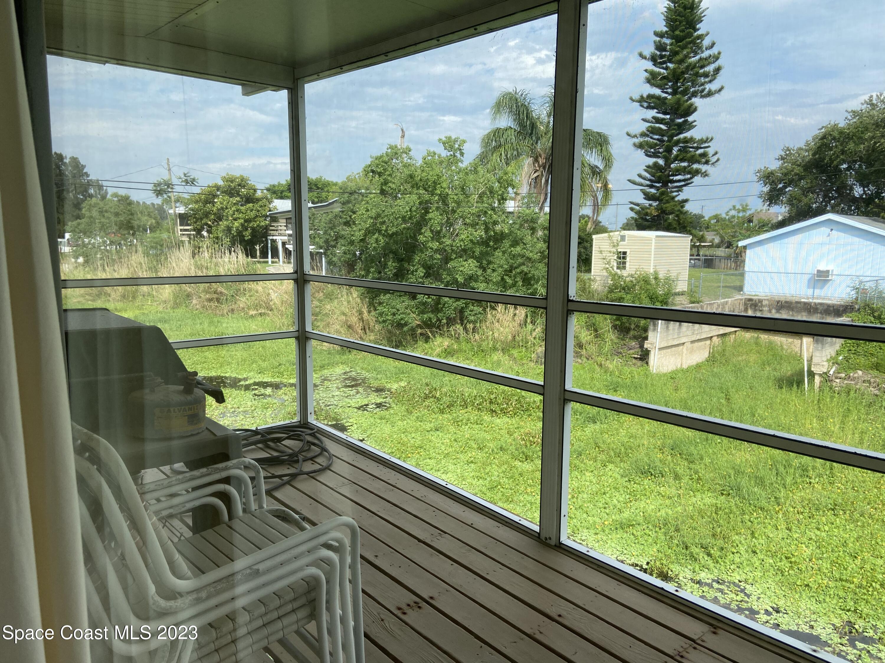 5757 Lake Poinsett Road Cocoa, FL 32926 - Photo 10 of 43 a view of a two chairs in the balcony