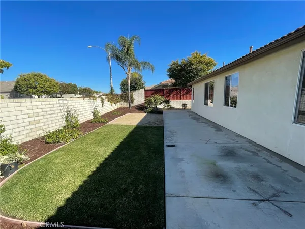 a view of a backyard of the house