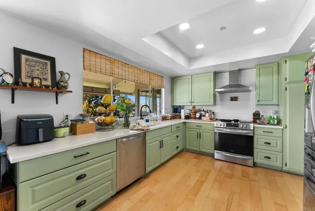 a kitchen with sink and cabinets