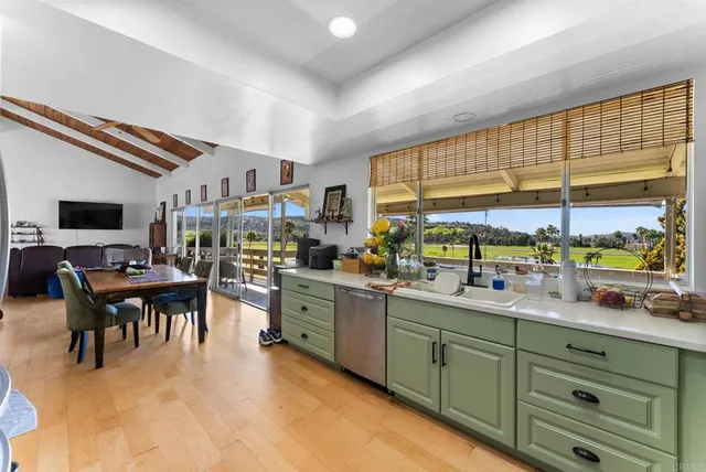 a kitchen with lots of counter top space and dining table