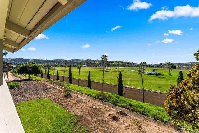 a view of a balcony with chairs