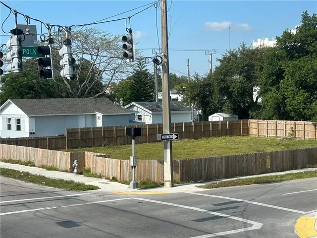 a view of a street with a building in the background