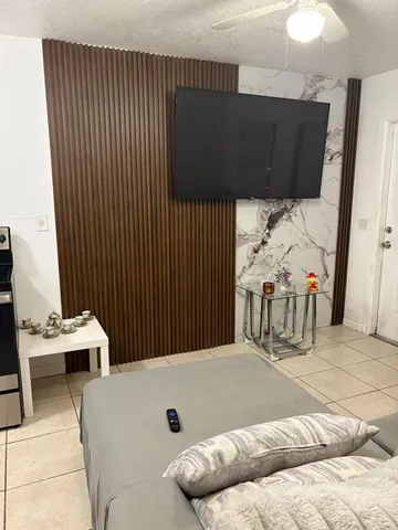 a bedroom with furniture and window