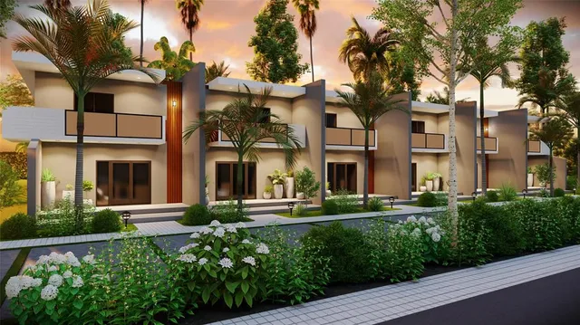 front view of a brick house with a yard