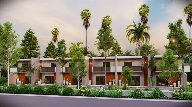 a view of multiple houses with a street