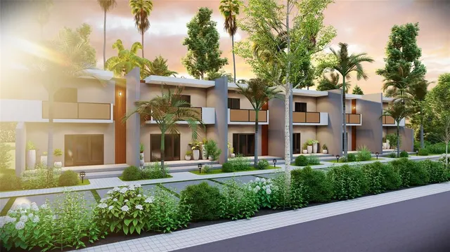 a front view of a building with a garden