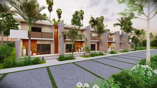 a front view of a multi story residential apartment building with yard and green space