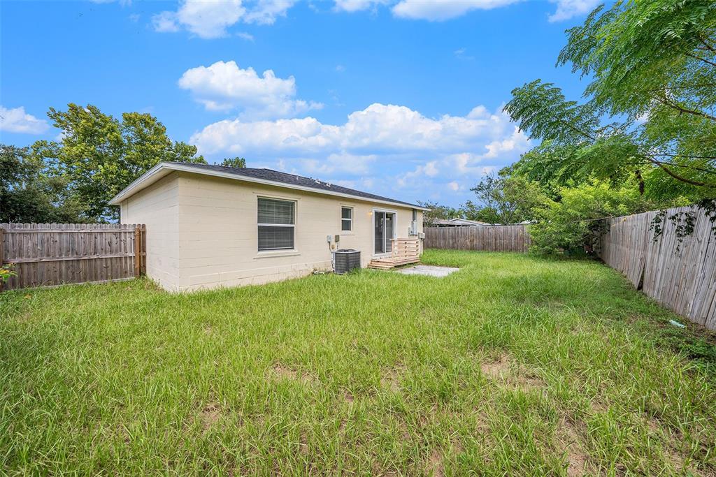 5850 13th Avenue New Port Richey, FL 34652 - Photo 15 of 15 a view of a house with backyard and garden