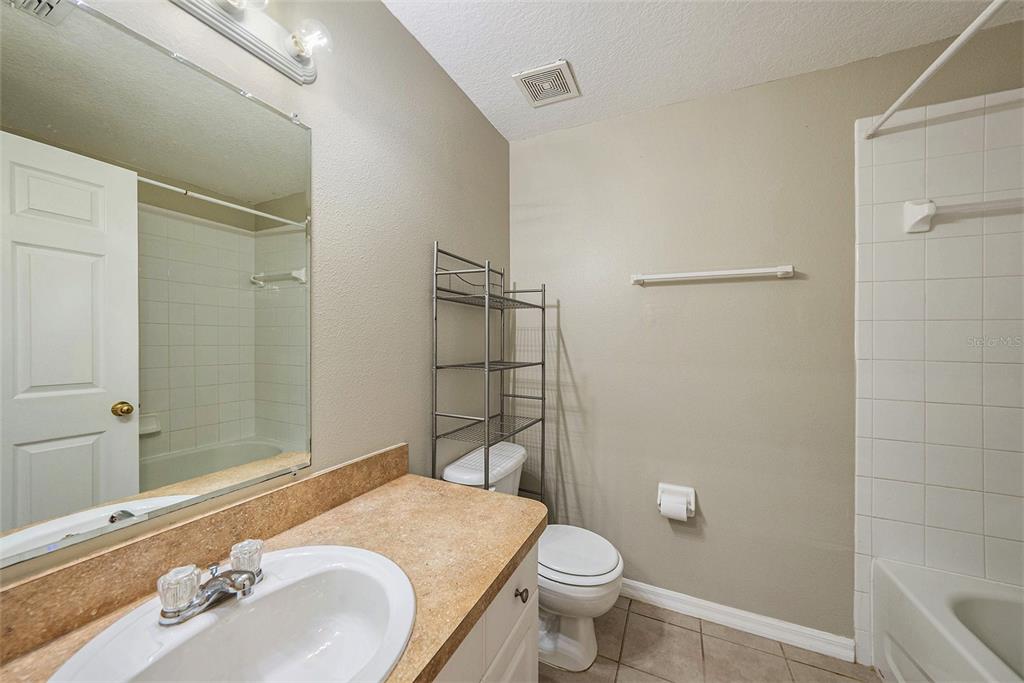 5850 13th Avenue New Port Richey, FL 34652 - Photo 8 of 15 a bathroom with a sink toilet and shower