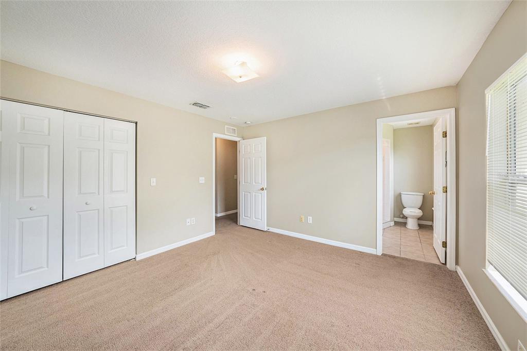 5850 13th Avenue New Port Richey, FL 34652 - Photo 10 of 15 wooden floor and closet in a room