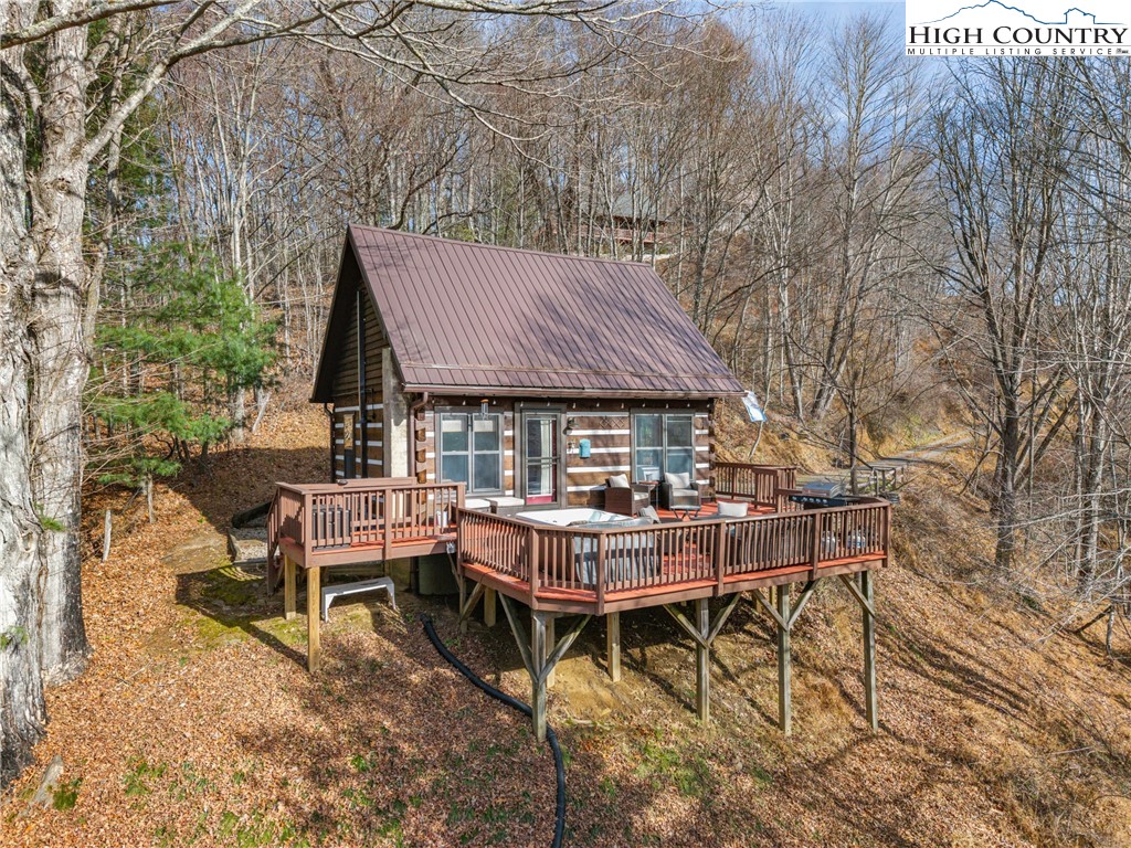 419 Billy Billings Road Vilas, NC 28692 - Photo 2 of 50 a view of house with backyard and sitting area