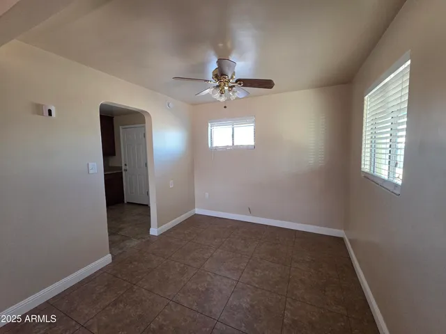 an empty room that has a window in it