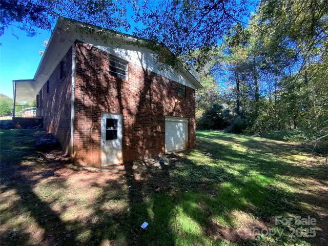 a view of a house with a tree