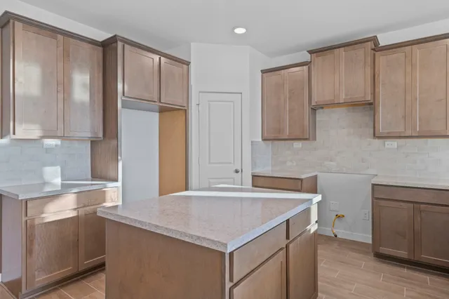 a kitchen with stainless steel appliances a sink stove and refrigerator