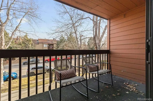 a view of a bench in wooden floor