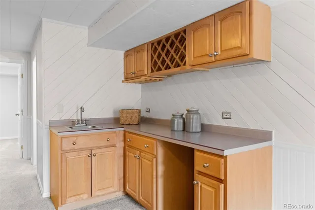 a kitchen with stainless steel appliances granite countertop a sink and cabinets