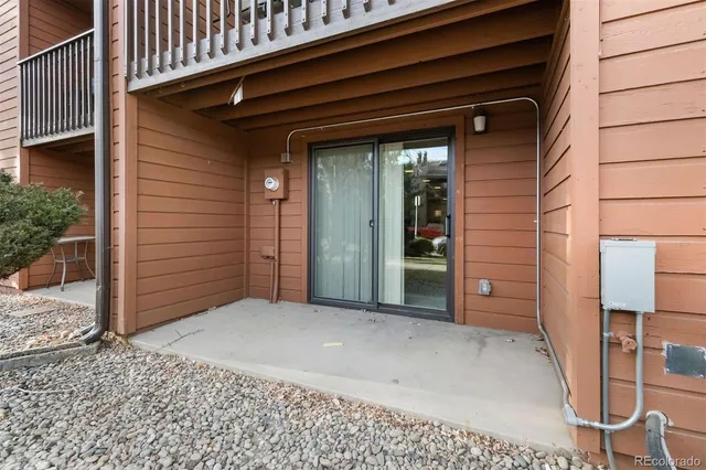 a view of a wooden door and a window