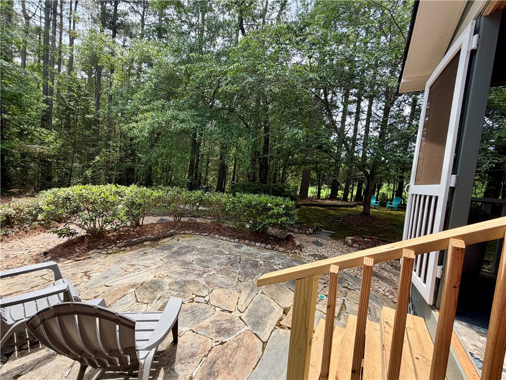 232 Hunters Trail Walhalla, SC 29691 - Photo 28 of 38 This tranquil outdoor space offers a flagstone patio, perfect for relaxing amidst lush greenery.