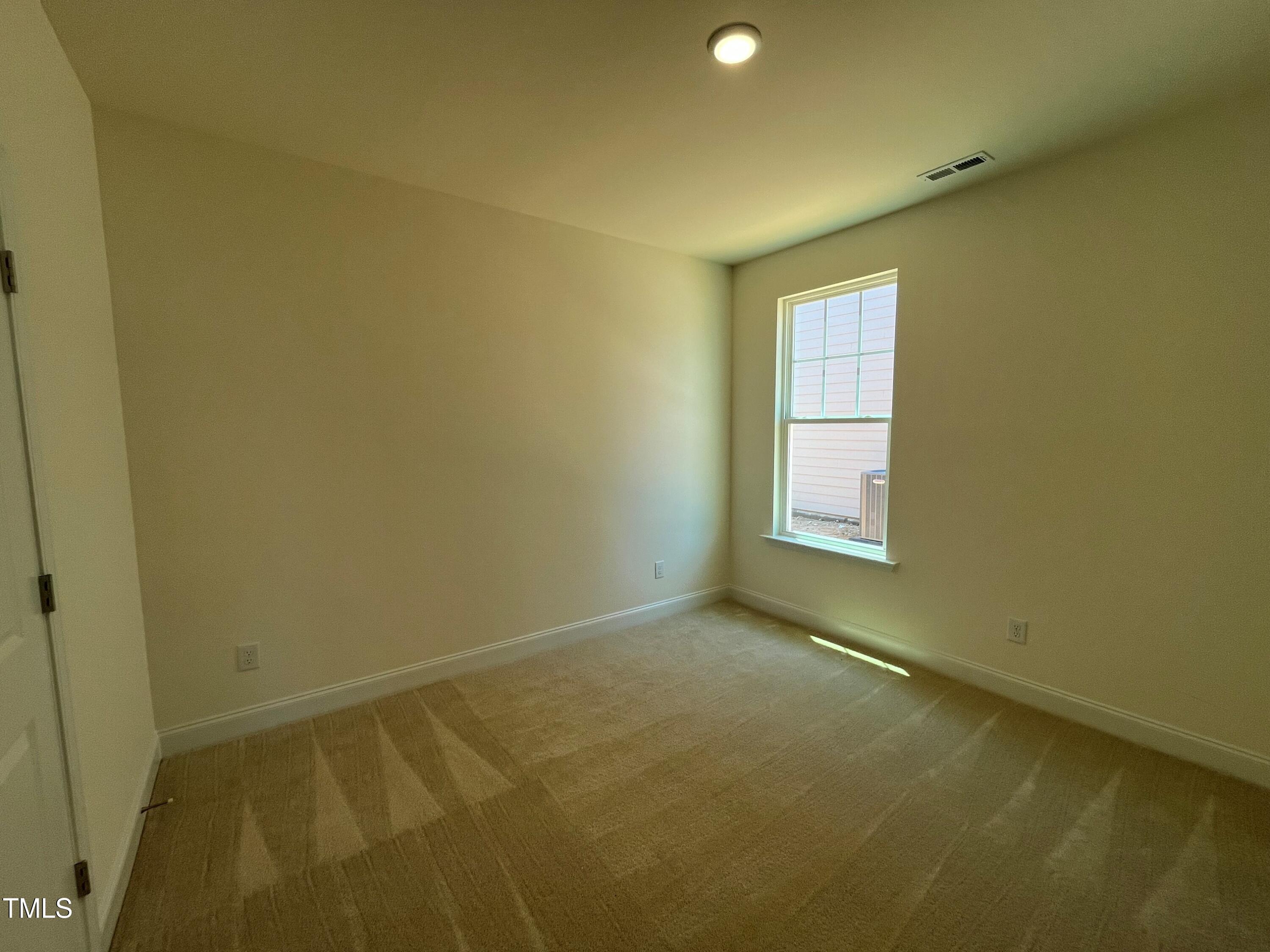 798 Old Station Pointe Angier, NC 27501 - Photo 4 of 19 an empty room with a empty space and a window